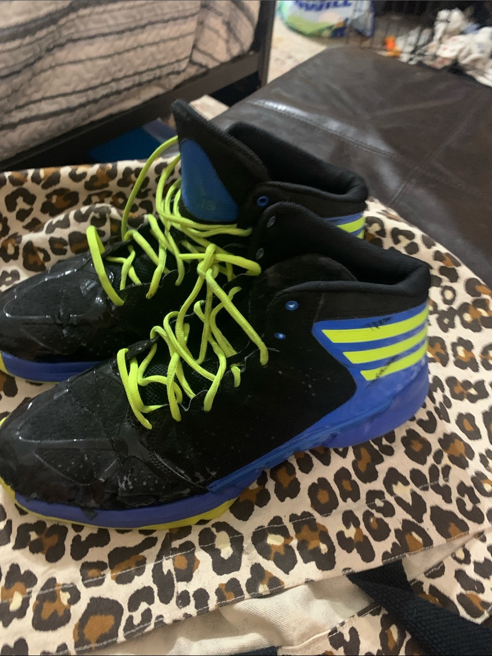 Black and Blue High-Top Athletic Shoes with Neon Yellow Laces